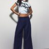 Pantaloni croiți cu croi larg și pense
