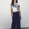 Pantaloni croiți cu croi larg și pense
