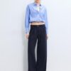 Pantaloni cu croi larg și detaliu cu cataramă Pantaloni cu croi larg și detaliu cu cataramă