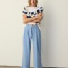 Pantaloni cu croi larg și detaliu cu cataramă Pantaloni cu croi larg și detaliu cu cataramă