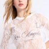 Tricou oversize din dantelă cu detalii grafice Tricou oversize din dantelă cu detalii grafice